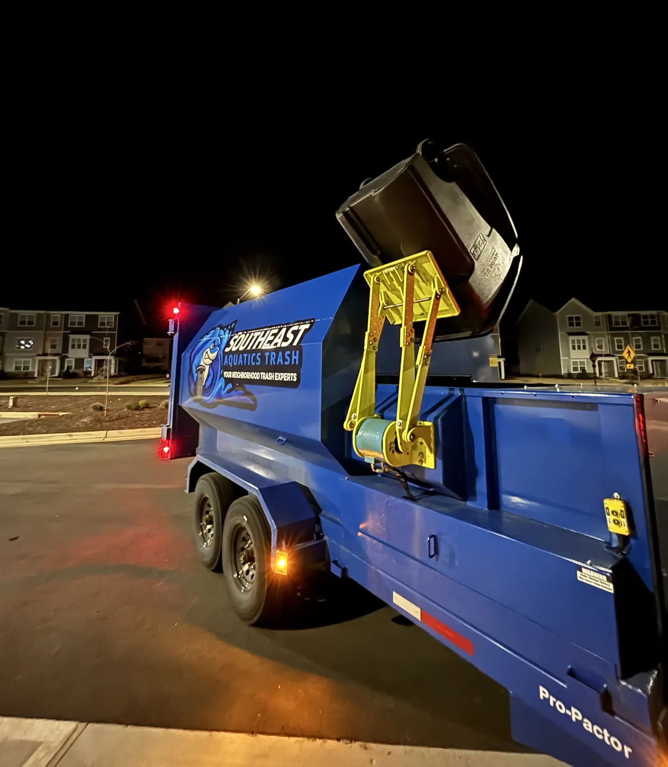 Southeast Aquatics Trash compactor servicing a community cart